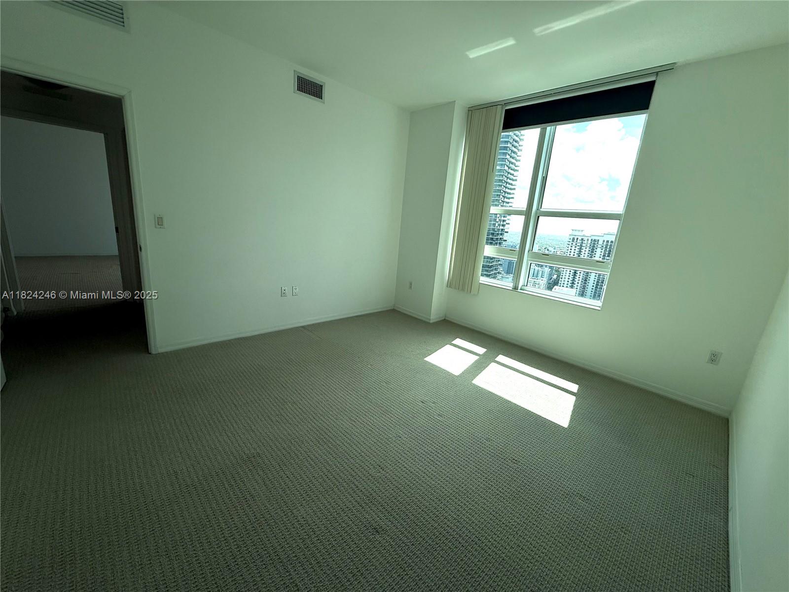 951 Brickell Avenue, Unit 3703 Miami, FL 33131 - Photo 11 of 34 a view of empty room with window