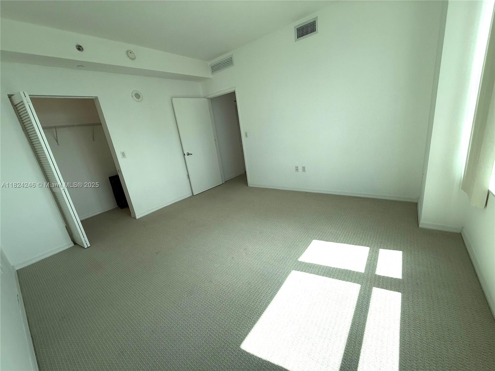 951 Brickell Avenue, Unit 3703 Miami, FL 33131 - Photo 9 of 34 a view of a big room with windows