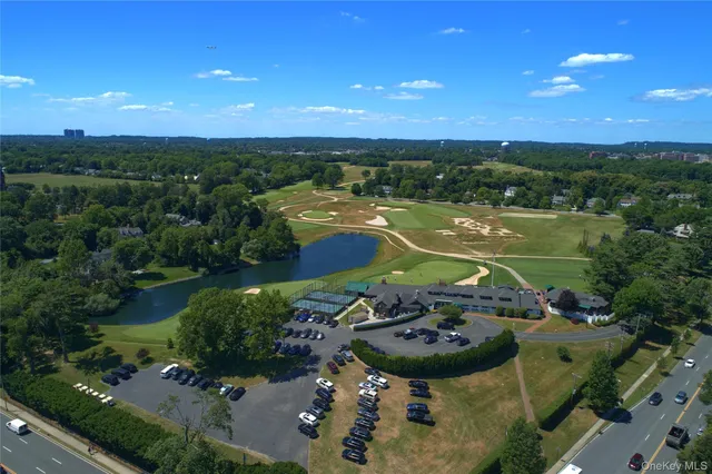 an aerial view of a house with a lake view