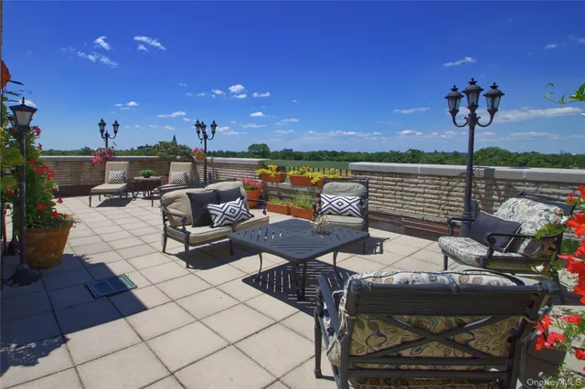 a view of a terrace with furniture