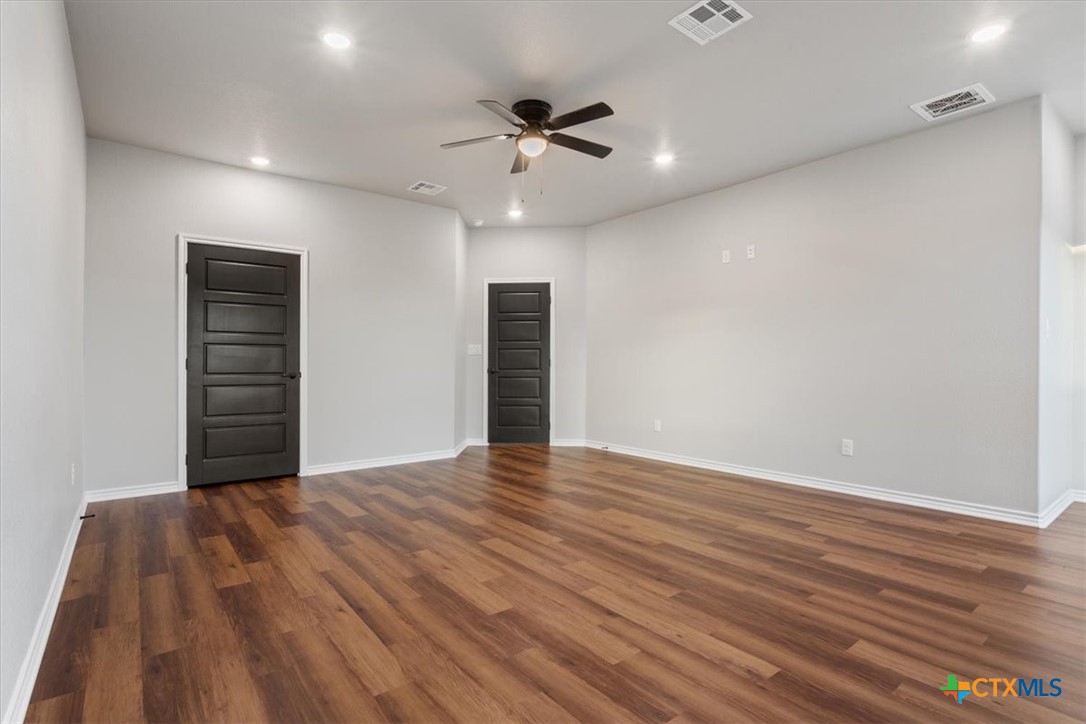 10940 Wedel Cemetery Road Rogers, TX 76569 - Photo 42 of 48 a view of an empty room with wooden floor