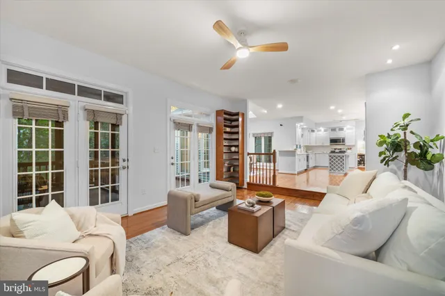 a dining room with furniture window and wooden floor