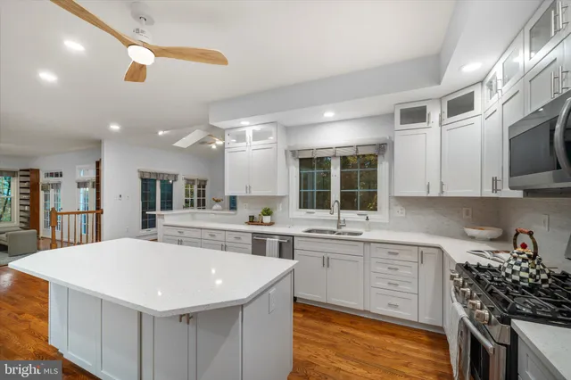a view of a balcony with furniture and wooden floor