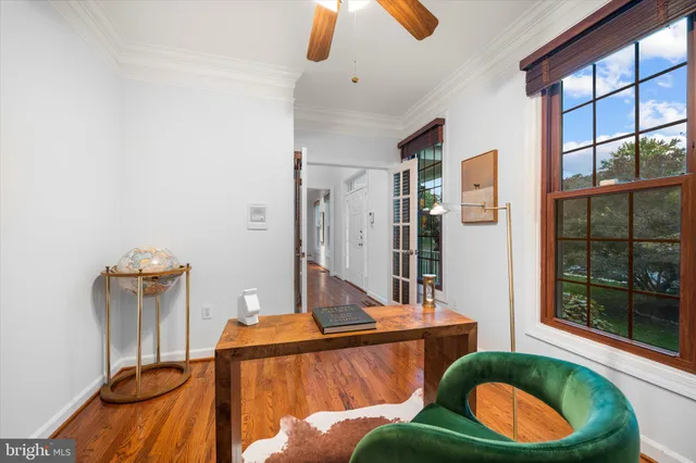 a view of a room with wooden floor and staircase