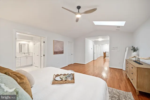 a bedroom with a bed and a bathroom