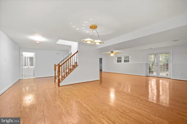 an aerial view of a house with a yard basket ball court and outdoor seating