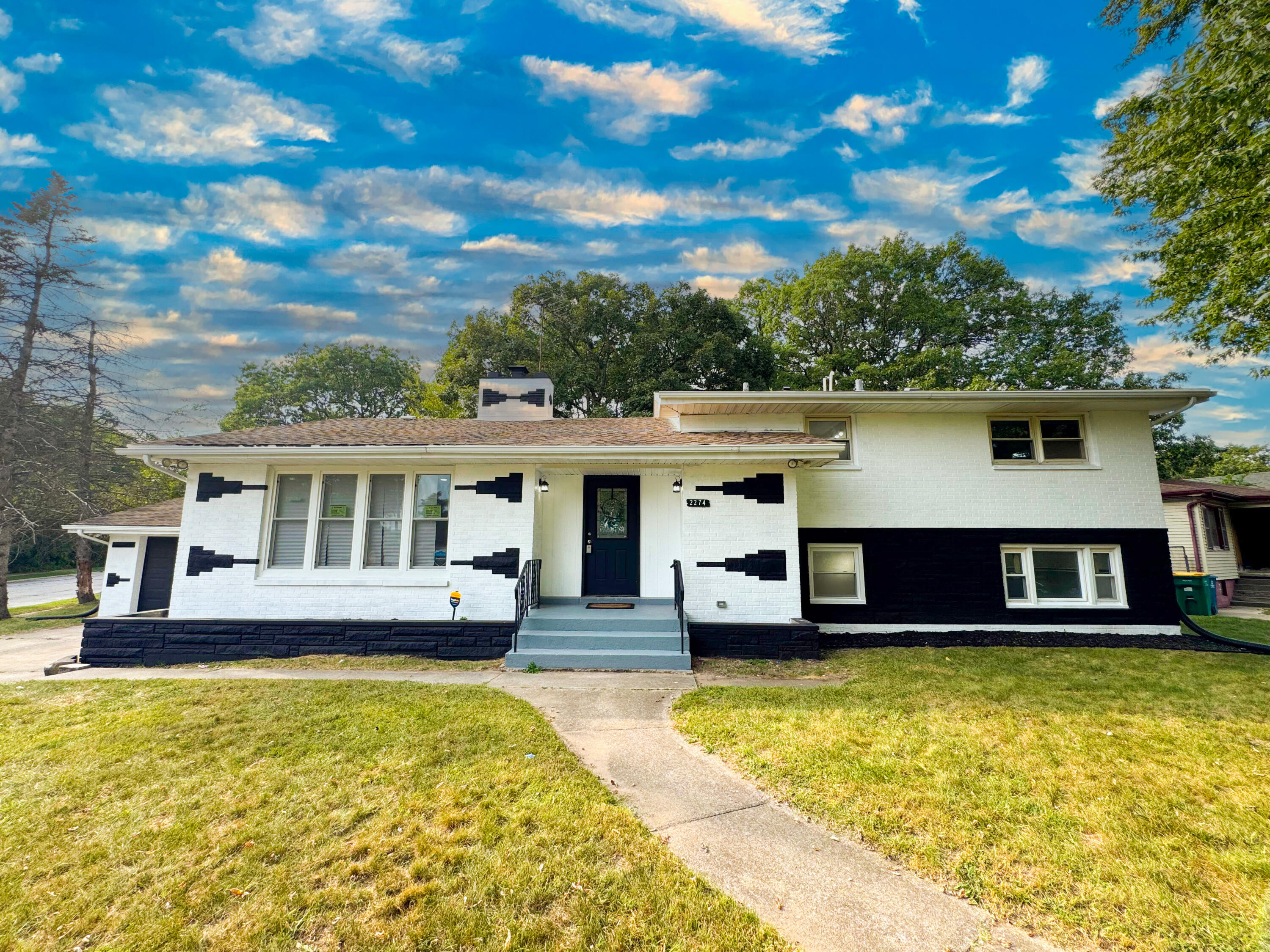 a front view of a house with swimming pool