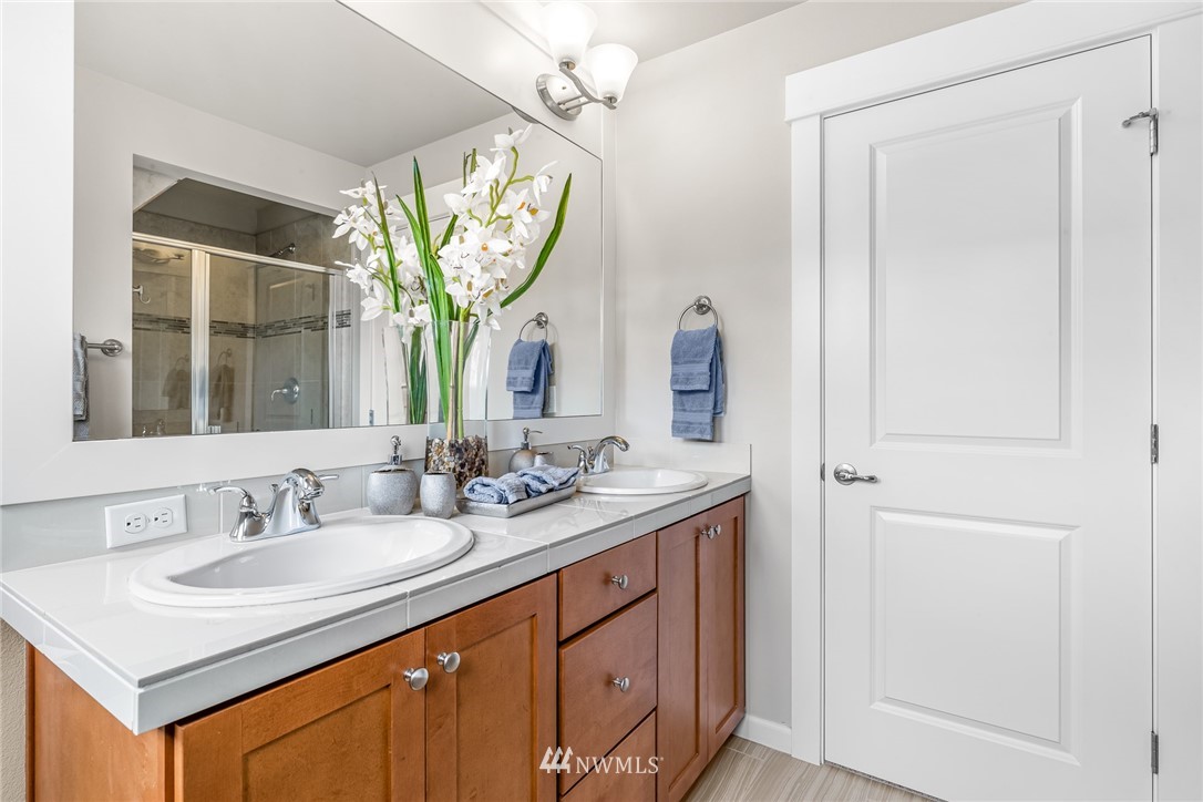 3715 218th Place Southeast Bothell, WA 98021 - Photo 22 of 37 a bathroom with a sink a vanity and a mirror