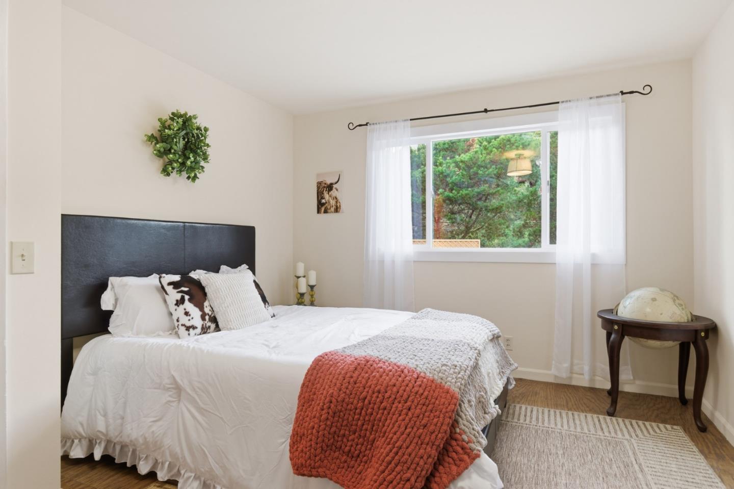 9805 Carmel Valley Road Carmel, CA 93923 - Photo 20 of 35 a bedroom with a bed and a window