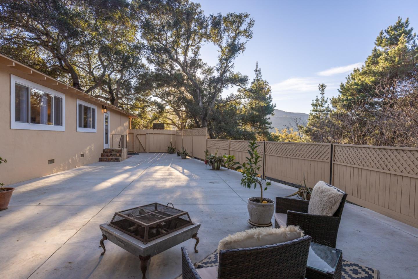 9805 Carmel Valley Road Carmel, CA 93923 - Photo 27 of 35 a backyard of a house with table and chairs