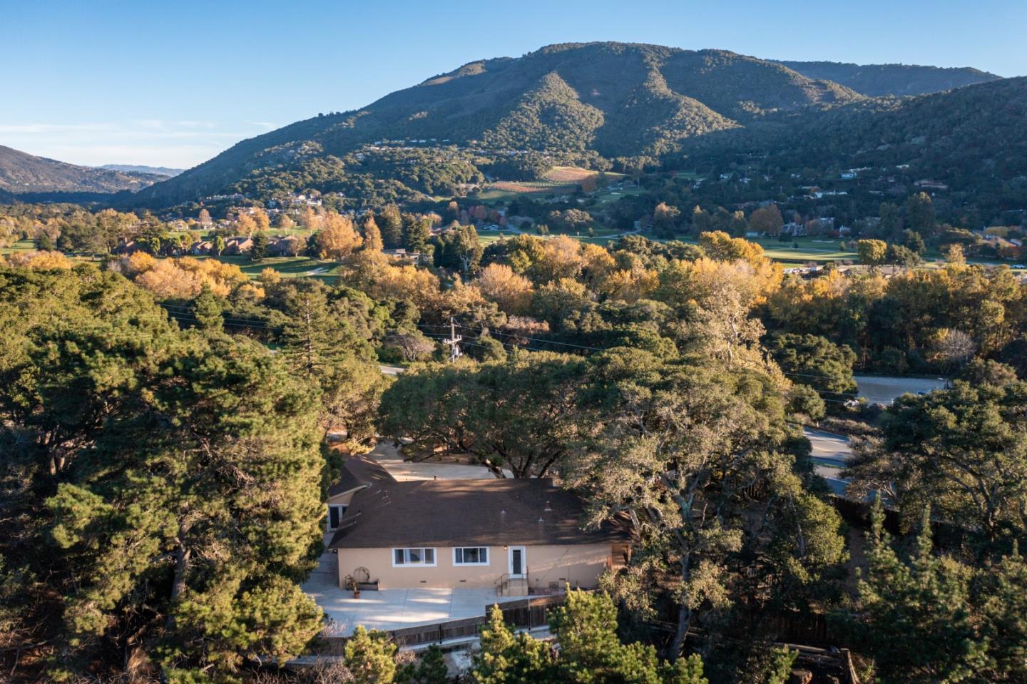9805 Carmel Valley Road Carmel, CA 93923 - Photo 32 of 35 a view of a house with a mountain