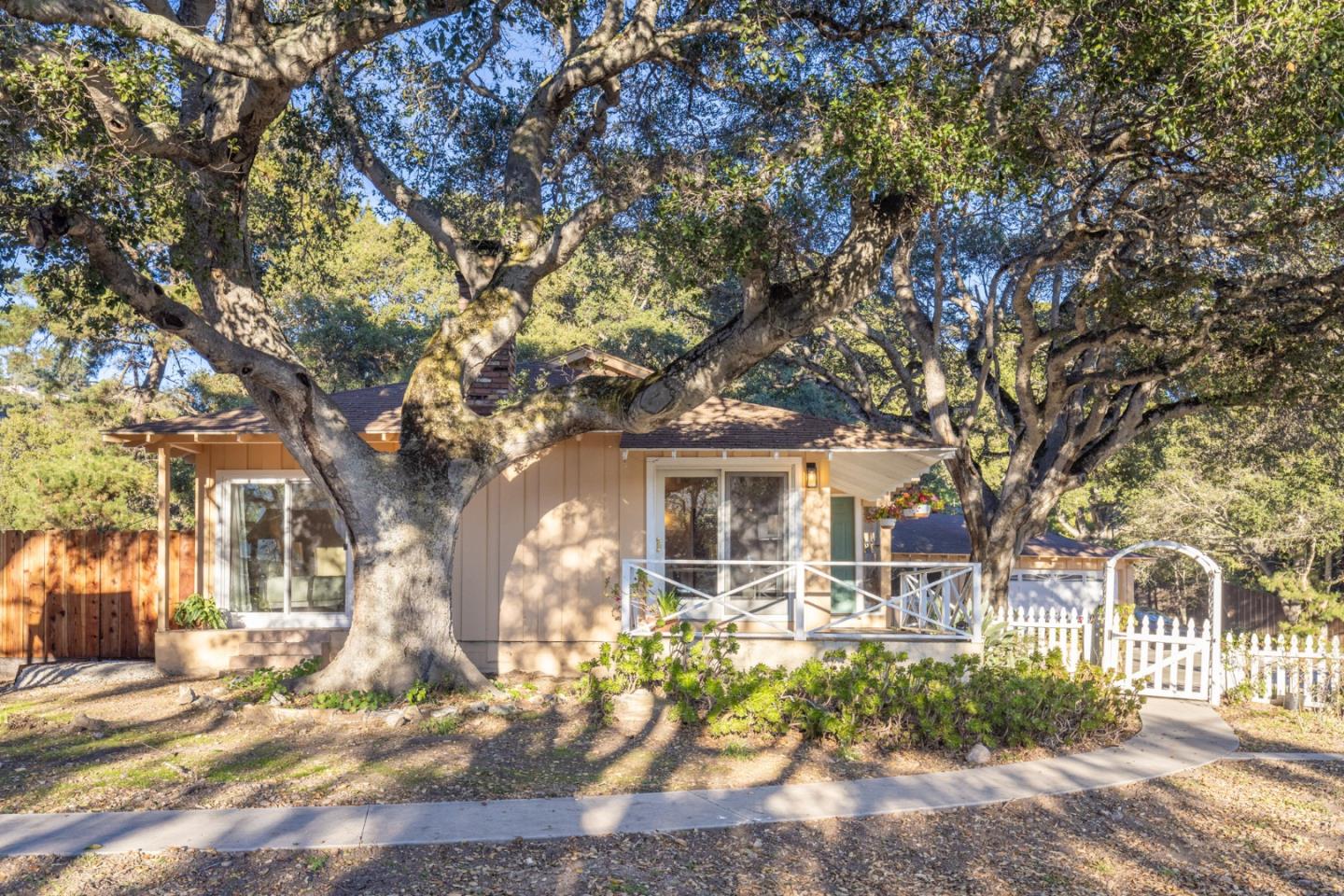 9805 Carmel Valley Road Carmel, CA 93923 - Photo 9 of 35 front view of house with a trees