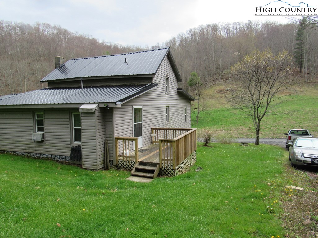 276 Greer Hollow Road Lansing, NC 28643 - Photo 27 of 40 a view of a house with backyard