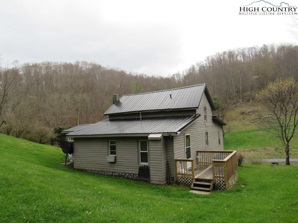 276 Greer Hollow Road Lansing, NC 28643 - Photo 6 of 40 a view of a house with a yard