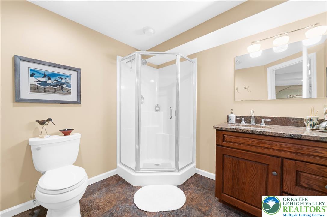 5616 Snowdrift Road Orefield, PA 18069 - Photo 23 of 36 A corner shower and single vanity offer a functional and pleasant bathroom space.