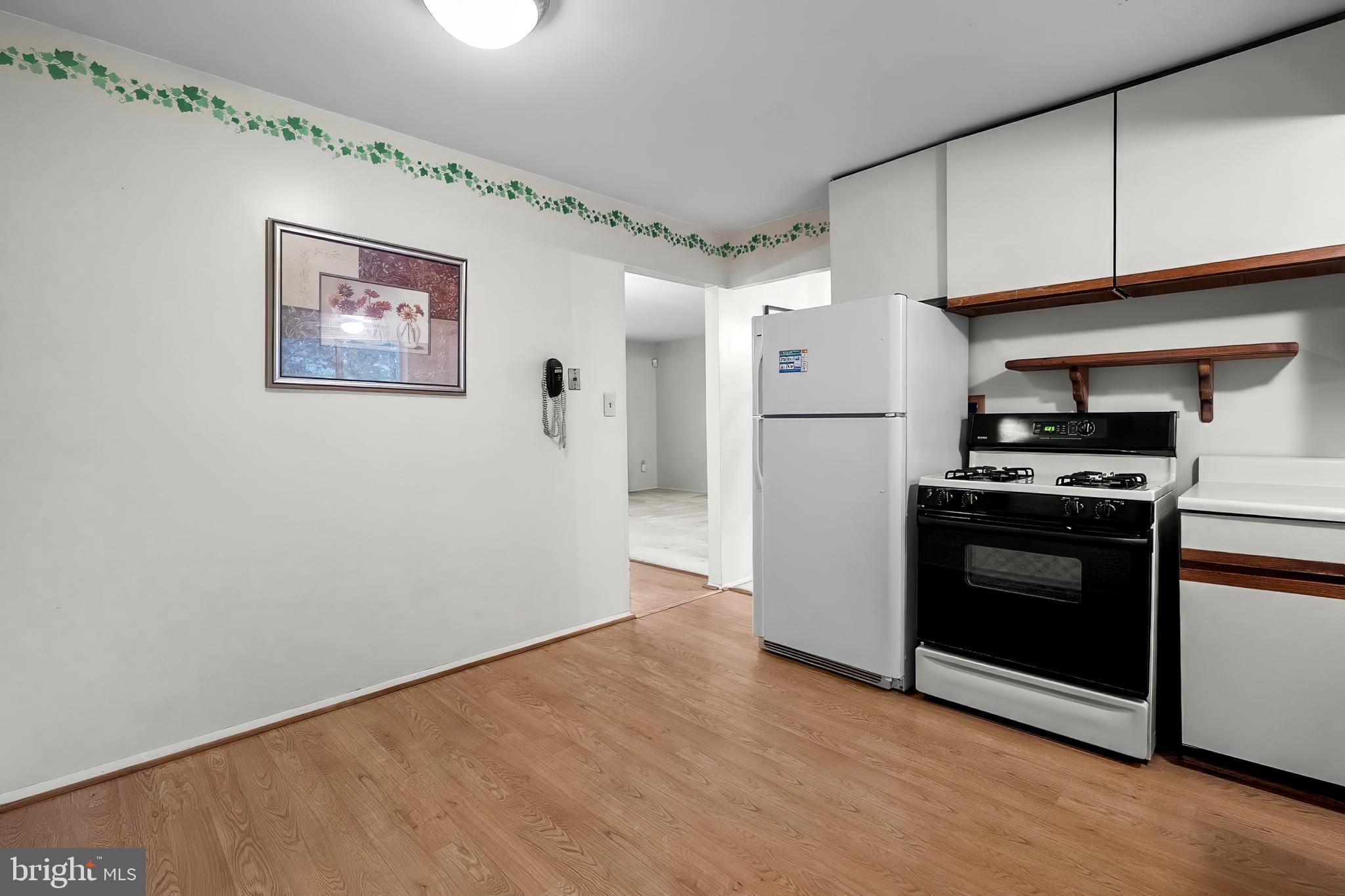 2015 Kennicott Road Baltimore, MD 21244 - Photo 12 of 26 a kitchen with a stove and a refrigerator