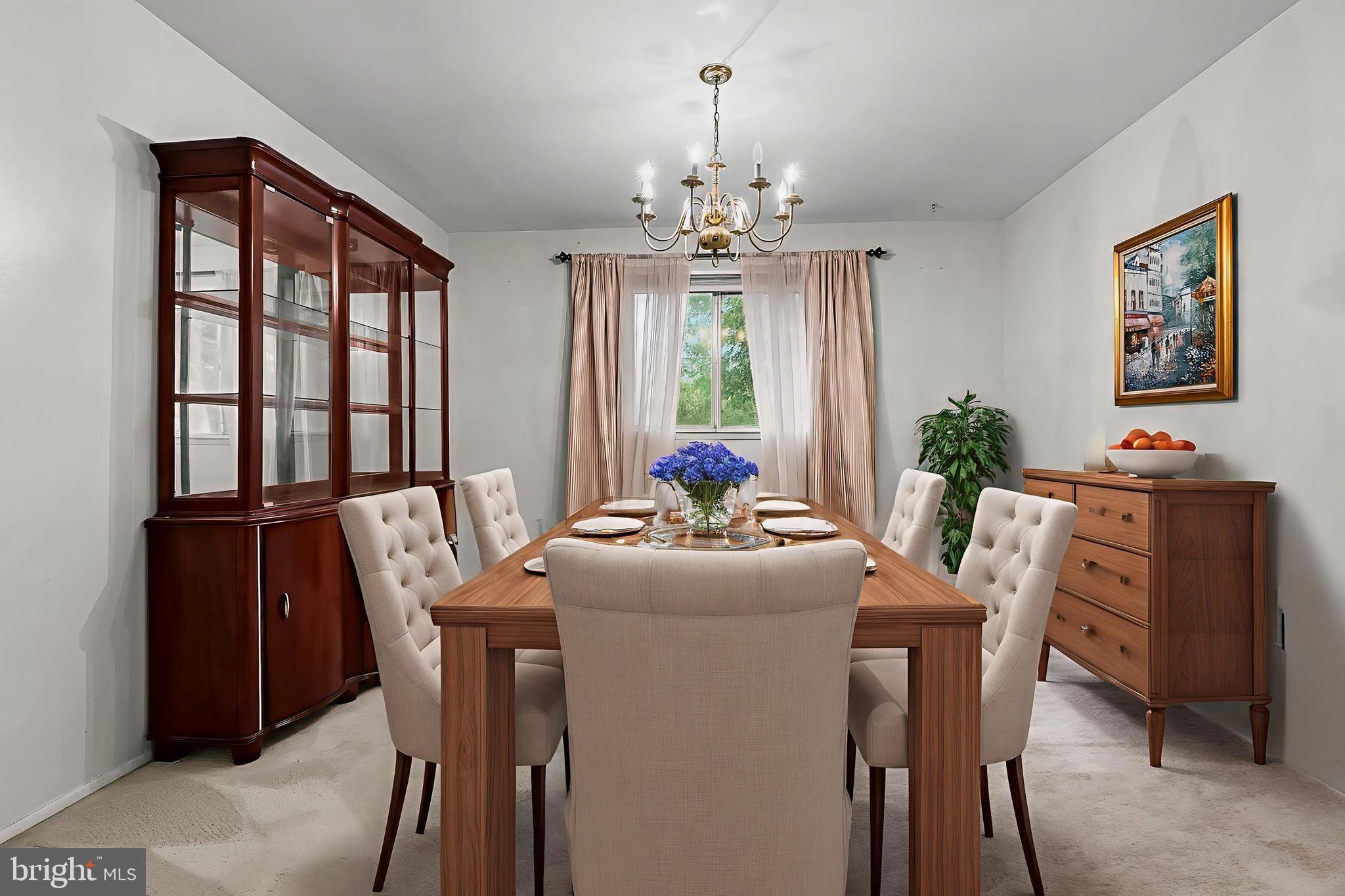 2015 Kennicott Road Baltimore, MD 21244 - Photo 6 of 26 a dining room with furniture a chandelier and window
