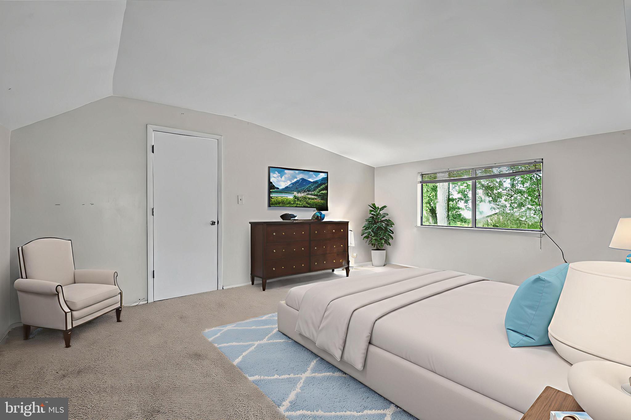 2015 Kennicott Road Baltimore, MD 21244 - Photo 10 of 26 a bedroom with a bed and a couch