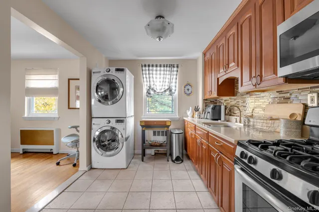 a kitchen with a stove a sink and a microwave