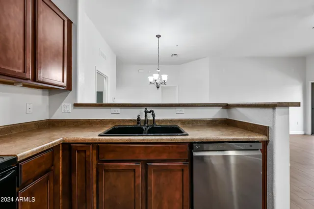 a kitchen with a sink and a refrigerator