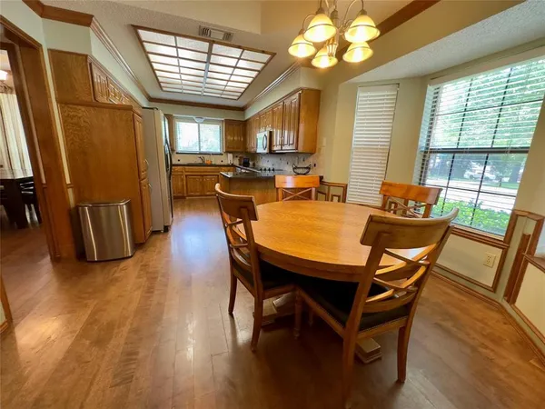 a dining room with furniture and window