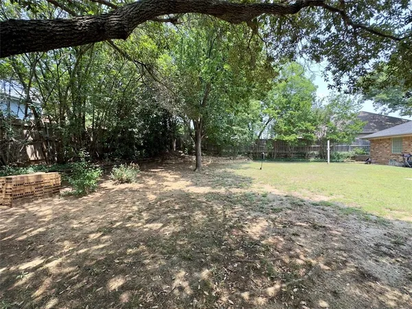 a view of outdoor space with deck and yard