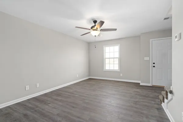 a view of an empty room with a window