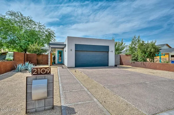 front view of a house with a yard