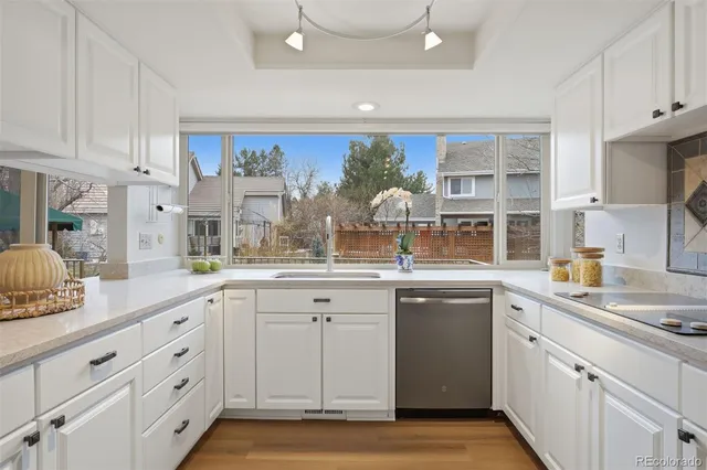 a kitchen with a sink and cabinets