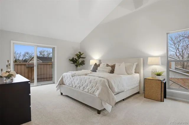 a spacious bedroom with a bed and window