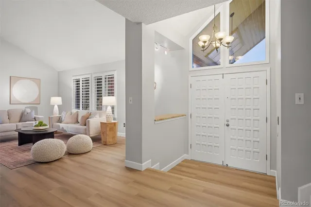 a bedroom with furniture and wooden floor