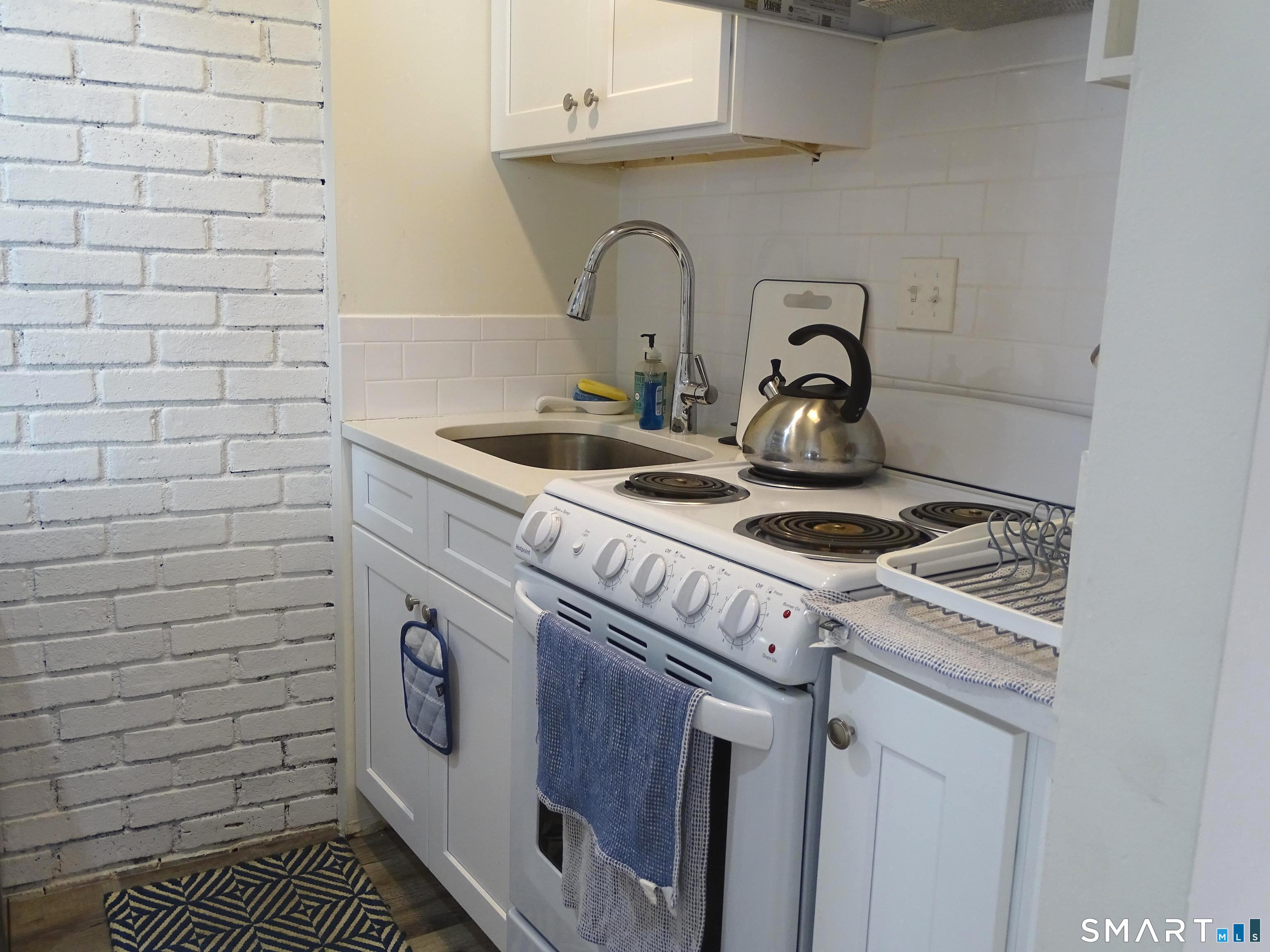 81 Church Street Branford, CT 06405 - Photo 11 of 21 a close view of washer and dryer