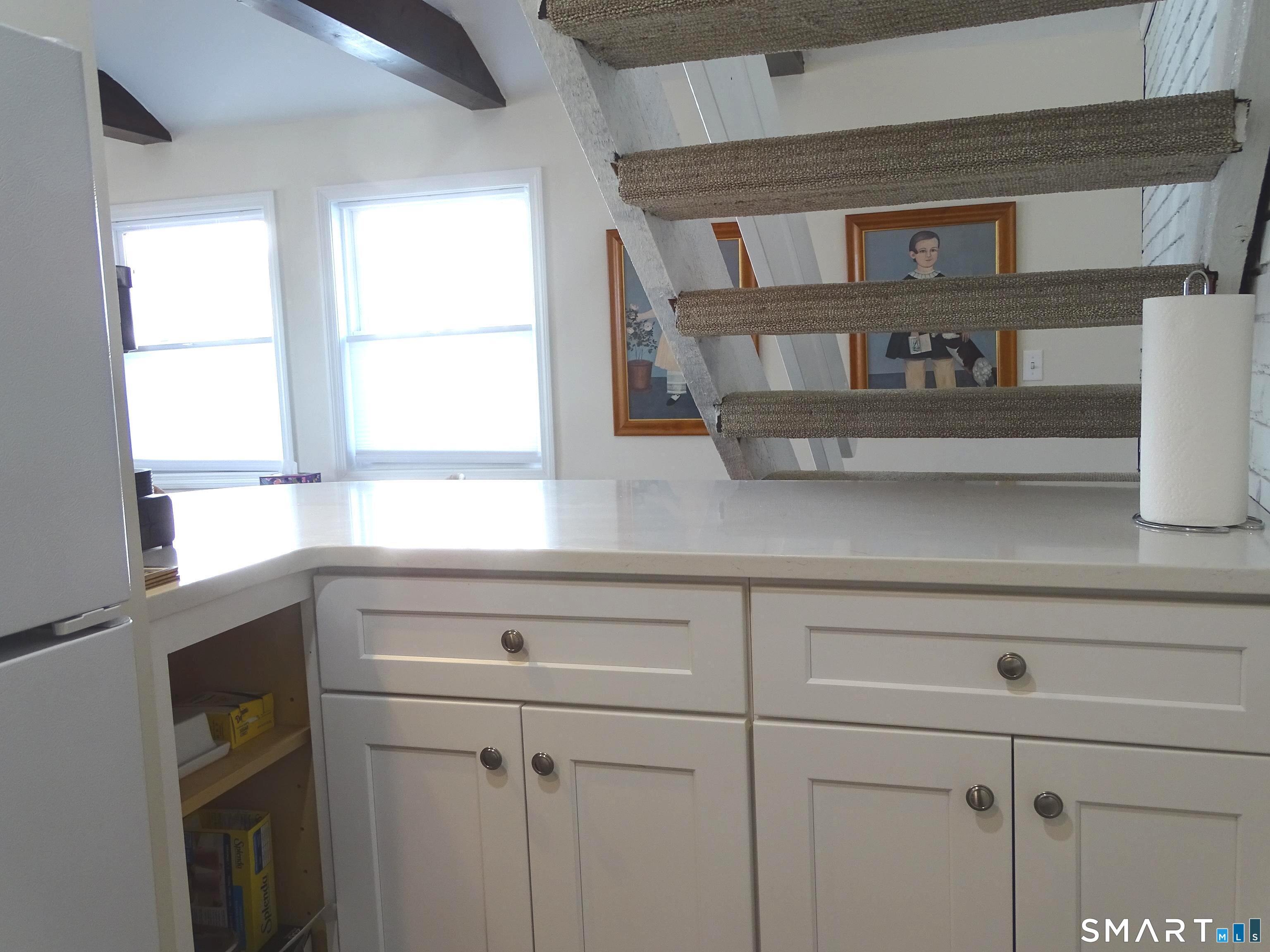 81 Church Street Branford, CT 06405 - Photo 12 of 21 a kitchen with a window and cabinets