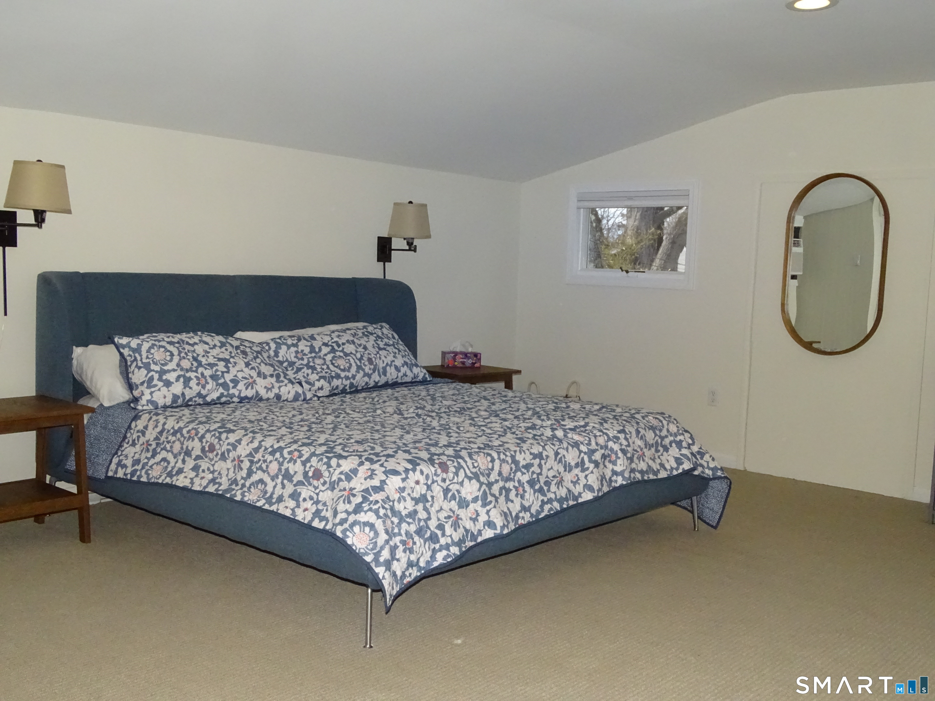 81 Church Street Branford, CT 06405 - Photo 17 of 21 a bedroom with a bed window and a table in it