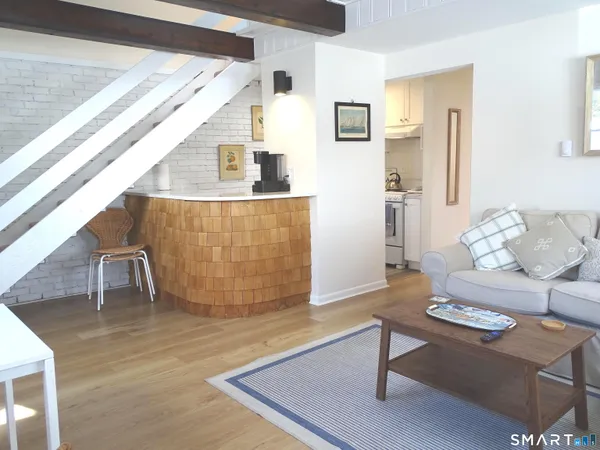 a living room with furniture and a table