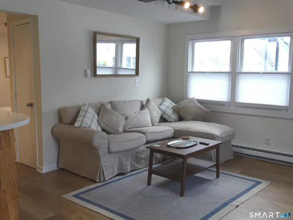 a living room with furniture and a window