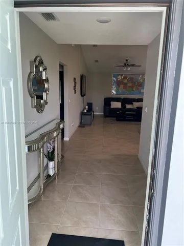 a view of an entryway and livingroom