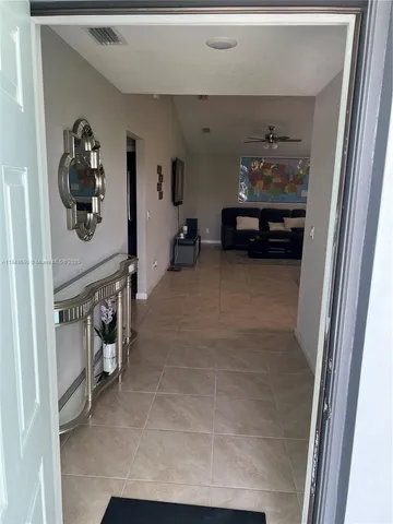 a view of a storage & utility room with a sink