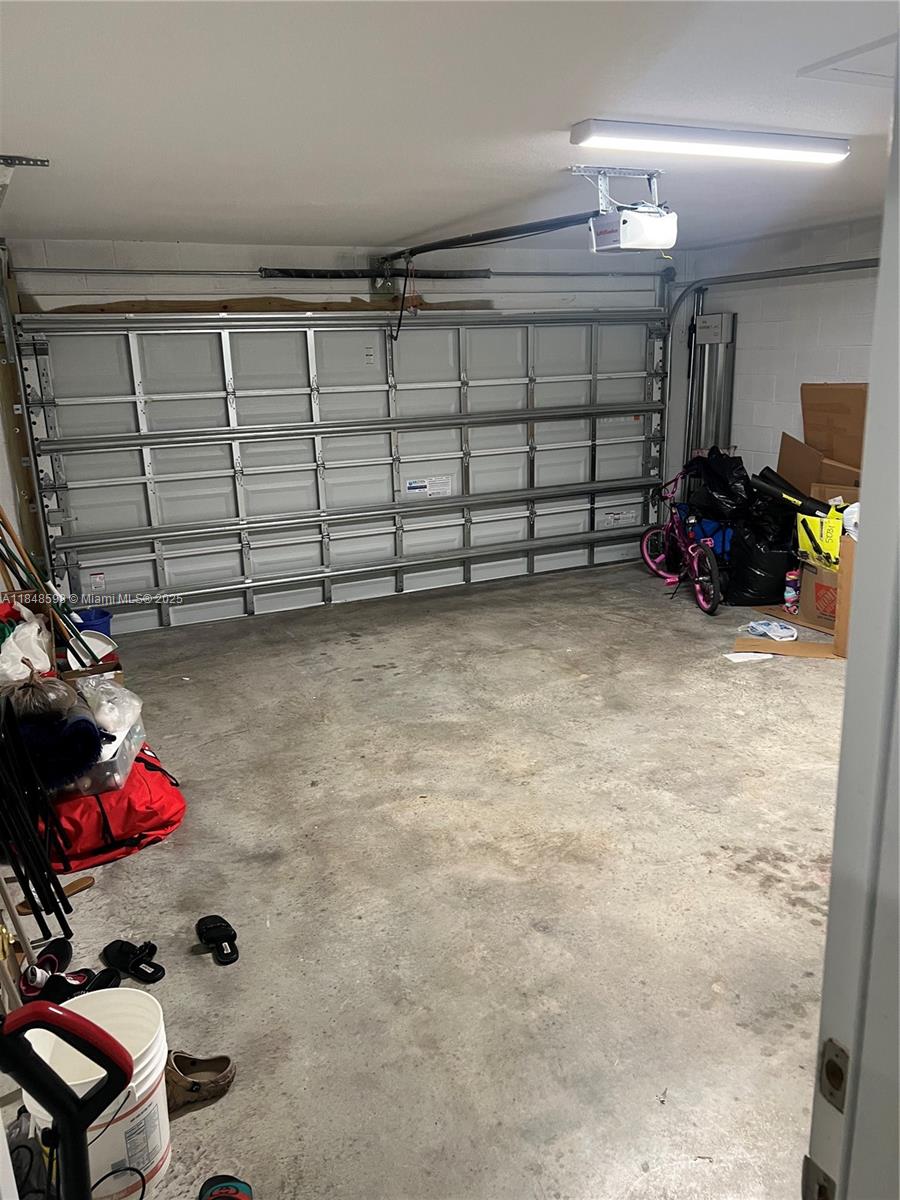 172 Southwest Langfield Avenue Port St. Lucie, FL 34984 - Photo 21 of 24 a view of a garage with toys