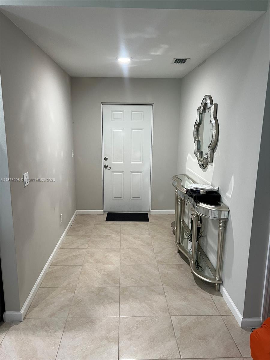 172 Southwest Langfield Avenue Port St. Lucie, FL 34984 - Photo 3 of 24 a view of a storage & utility room with a sink