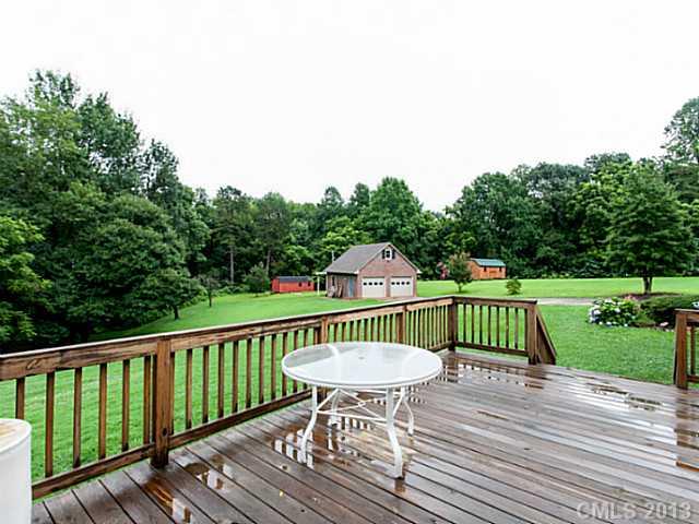 365 Gregory Road Salisbury, NC 28147 - Photo 15 of 16 a view of a chair and table on the wooden deck