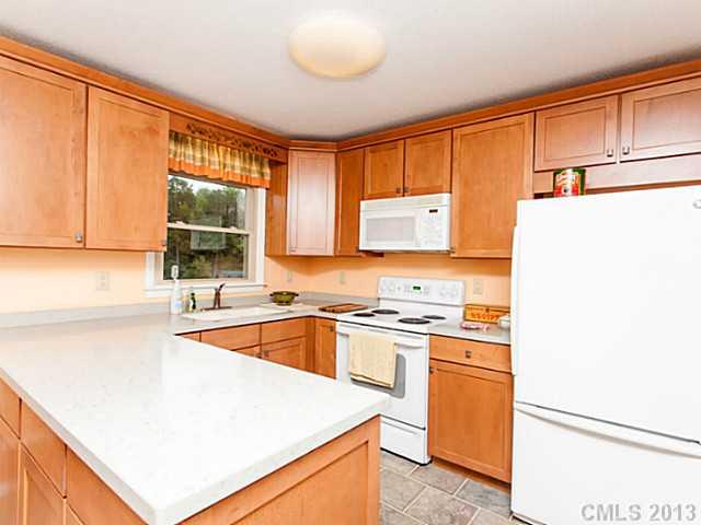 365 Gregory Road Salisbury, NC 28147 - Photo 5 of 16 a kitchen with stainless steel appliances granite countertop a sink and a stove