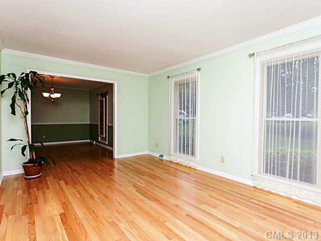 365 Gregory Road Salisbury, NC 28147 - Photo 9 of 16 a view of an empty room with wooden floor and a window