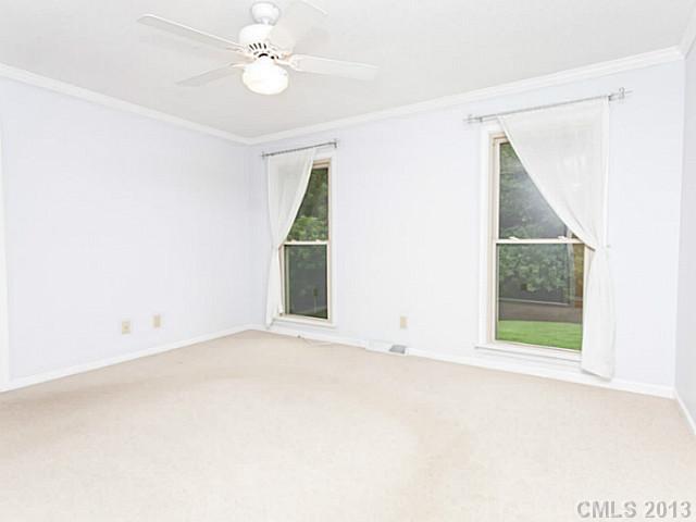 365 Gregory Road Salisbury, NC 28147 - Photo 10 of 16 an empty room with windows and fan
