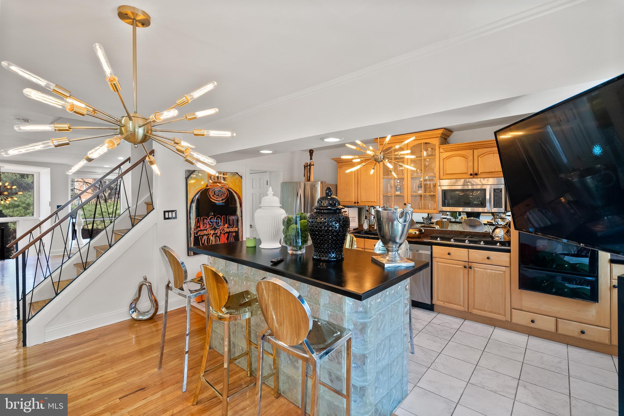 2737 East Country Club Road Philadelphia, PA 19131 - Photo 11 of 24 a kitchen with stainless steel appliances granite countertop a sink a stove and a refrigerator