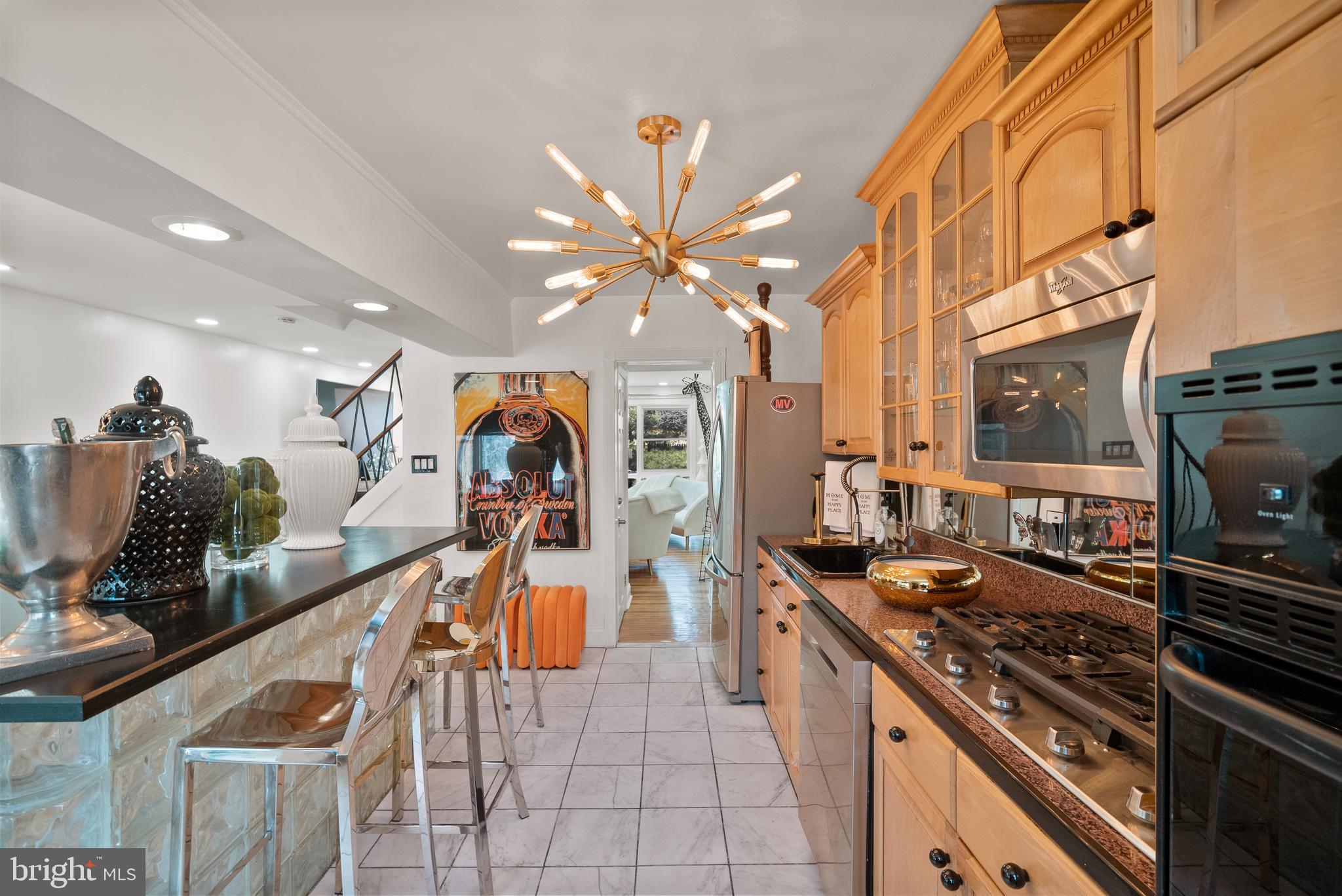 2737 East Country Club Road Philadelphia, PA 19131 - Photo 13 of 24 a kitchen with stainless steel appliances granite countertop a stove and a sink
