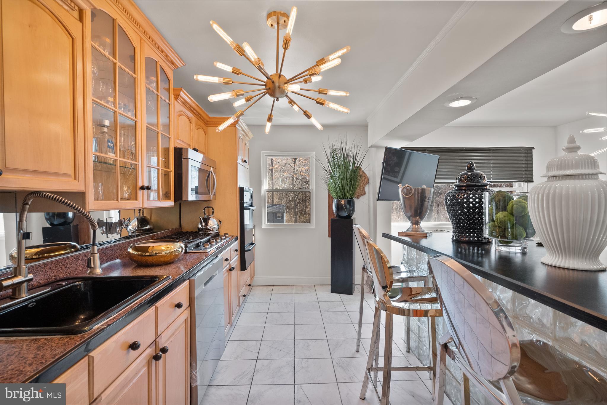 2737 East Country Club Road Philadelphia, PA 19131 - Photo 14 of 24 a kitchen with a sink and appliances
