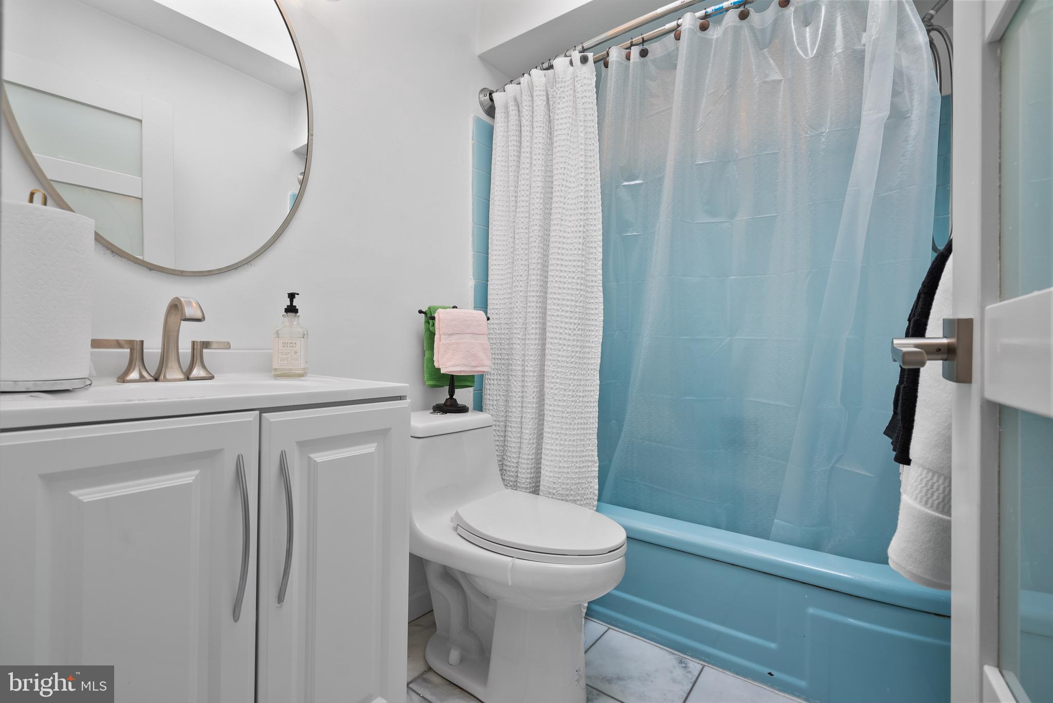 2737 East Country Club Road Philadelphia, PA 19131 - Photo 22 of 24 a bathroom with a sink a toilet and shower
