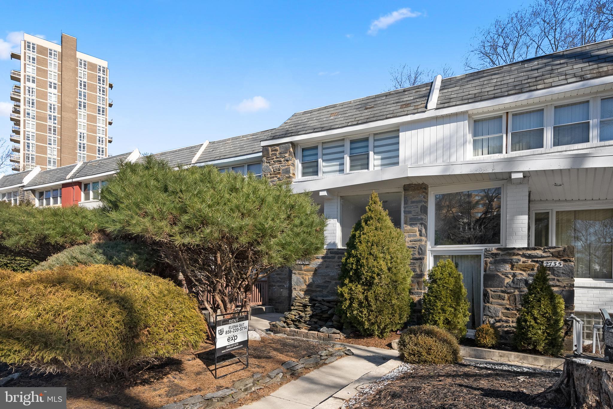 2737 East Country Club Road Philadelphia, PA 19131 - Photo 23 of 24 a front view of a house with a yard