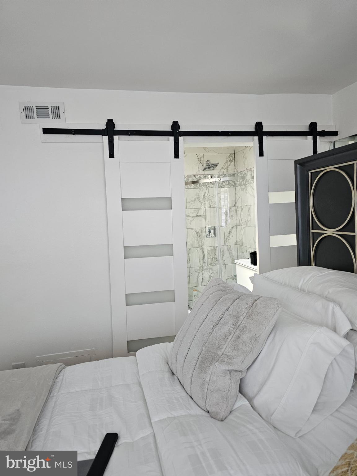 2737 East Country Club Road Philadelphia, PA 19131 - Photo 5 of 24 a bedroom with a bed and a window